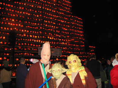 Posing in front of a tower of jack-o-lanterns