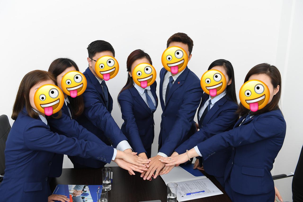 an example picture of a group of people whose faces have been automatically replaced with emojis